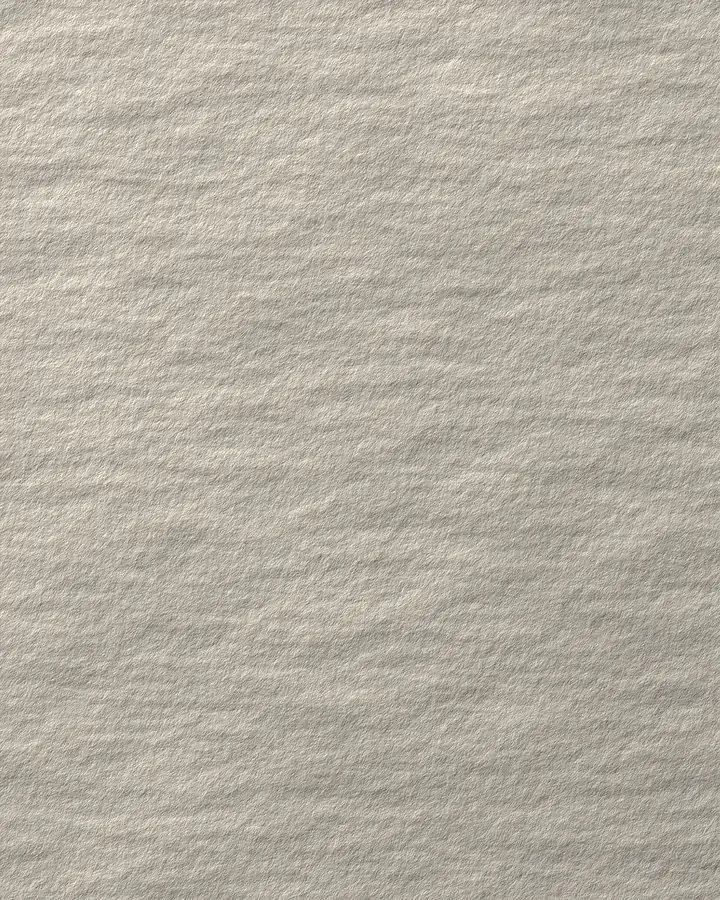 Nahaufnahme einer rohen, körnigen Putzoberfläche.